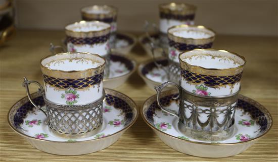 A set of six Wedgwood coffee cans and saucers, with silver plated holders